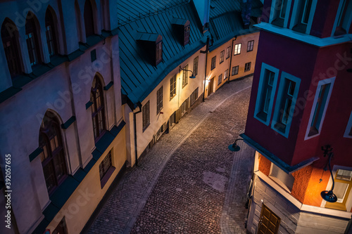 Stockholm, Sweden. Cobbled street in Sodermalm. Color street with cobblestone road, streetlight. Narrow street
