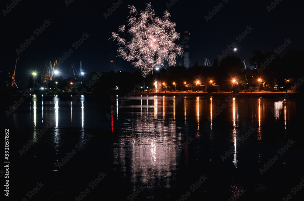 Fireworks in the Taganrog port. Lights on the waterfront