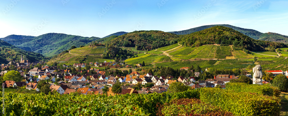 Panoramic view of the stunning village of Andlau in Alsace. Slopes with ripening grapes. Great views of the Vosges mountains. Idyll and grace.