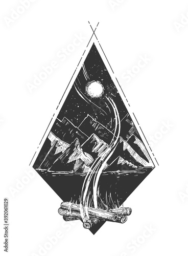 Bonfire at night in mountain camp