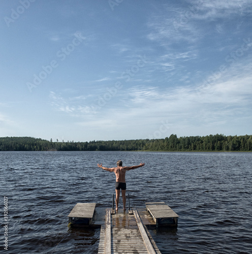 wooden footbridge on a lake in Finland.
