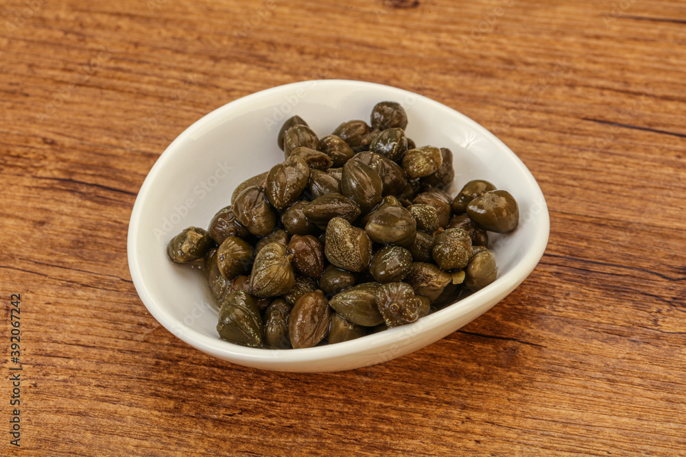 Tasty capers in the bowl Tasty capers in the bowl