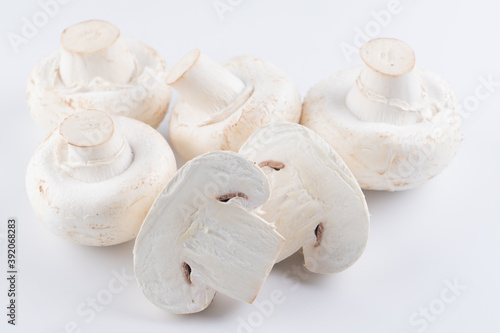Raw fresh white champignons isolated on white background with clipping path