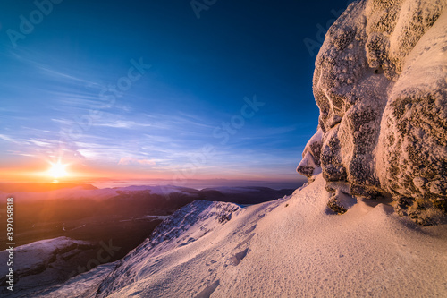 Snowy Winter Sunrise from the Summit of Ben More photo