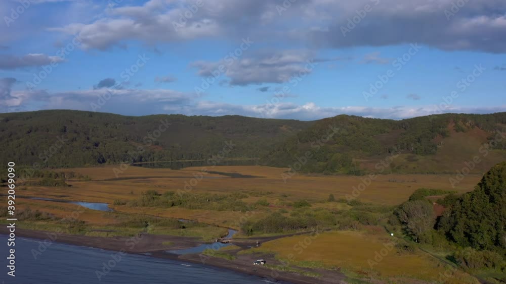 Autumn landscapes of Kamchatka. Travel to the Kamchatka Peninsula. Majestic cliffs, hills and mountains. Autumn landscapes of Kamchatka. Travel to the Kamchatka Peninsula. Majestic cliffs, hills and mountains.