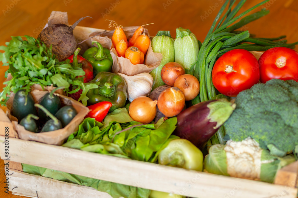 Wooden crate full of fresh organic vegetables