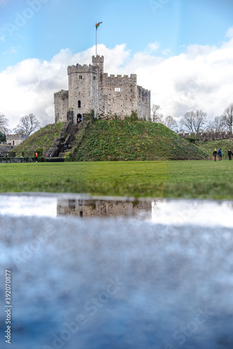 Lovely image of Cardiff Castle, Wales. Reflections of Cardiff Castle. The flag of Wales flies atop the castle 3