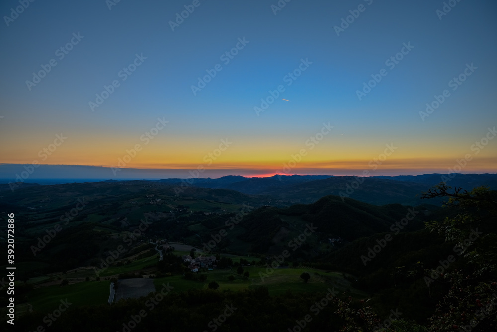 Colorful morning sky before sunrise in the mountains. Natural background. Camping, travel, trekking concept