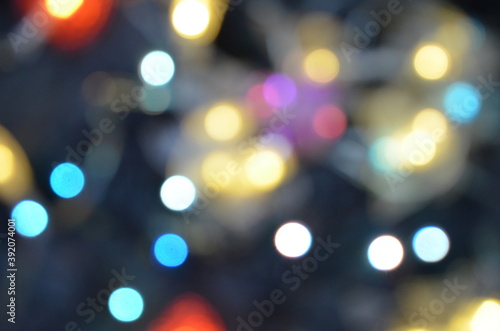 Red yellow blue and orange holiday bokeh. Abstract Christmas background new year background, no focus, blur, blurry