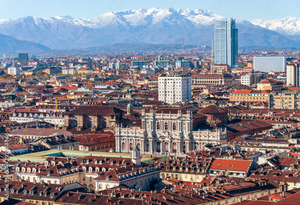Aerial view of the city of Turin with the background of the Alps covered by snow taken from the top of Mole Antonelliana