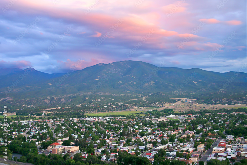 Salida Colorado Overlook - Aerial view of Salida Colorado, with beautiful pink sunset cloud overhead and mountain range in background. Chaffee County.