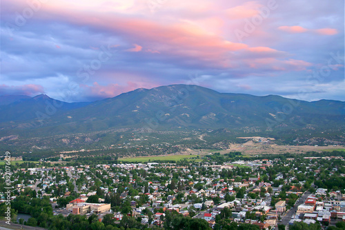Salida Colorado Overlook - Aerial view of Salida Colorado, with beautiful pink sunset cloud overhead and mountain range in background. Chaffee County. photo
