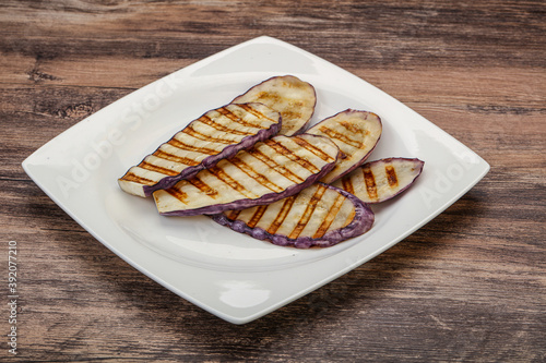 Grilled graffiti eggpant slices with oil photo