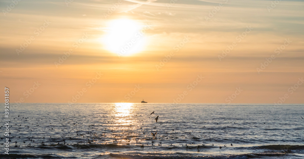 Beautiful sea sunset in yellow-beige colors as a background.