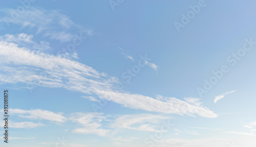 Bright sky background with few cirrus clouds