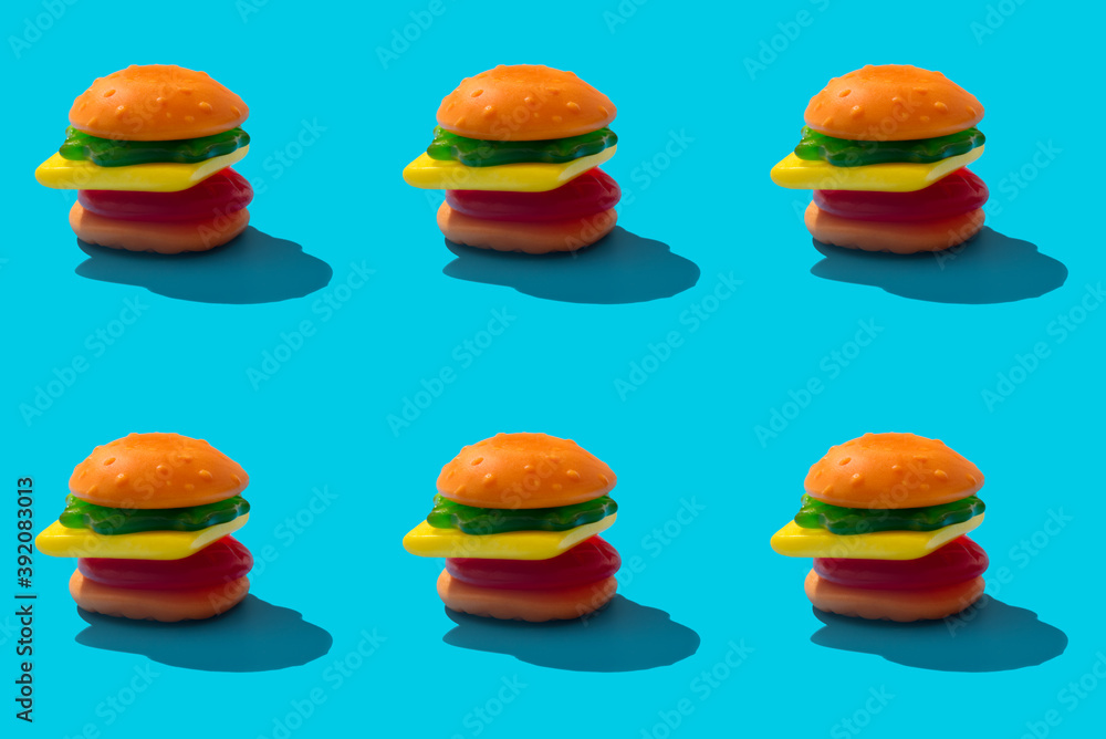 Toy hamburger fast food pattern on blue background Toy hamburger fast food pattern on blue background