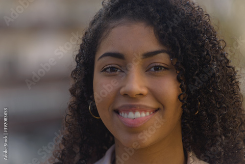 Black woman smilling on urban background