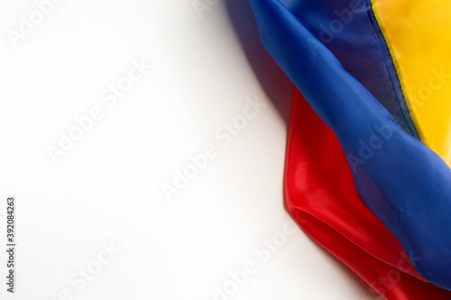 flag of ecuador, venezuela, colombia wrinkled placed on a white background on the right diagonal side