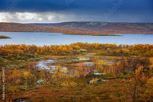 Storm clouds over a lake in the tundra in autumn. Kola Peninsula, Russia.