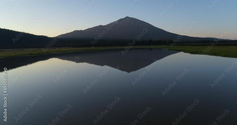 Wide aerial, reflective Sparkle Lake underneath Mt. Bachelor in Oregon Wide aerial, reflective Sparkle Lake underneath Mt. Bachelor in Oregon