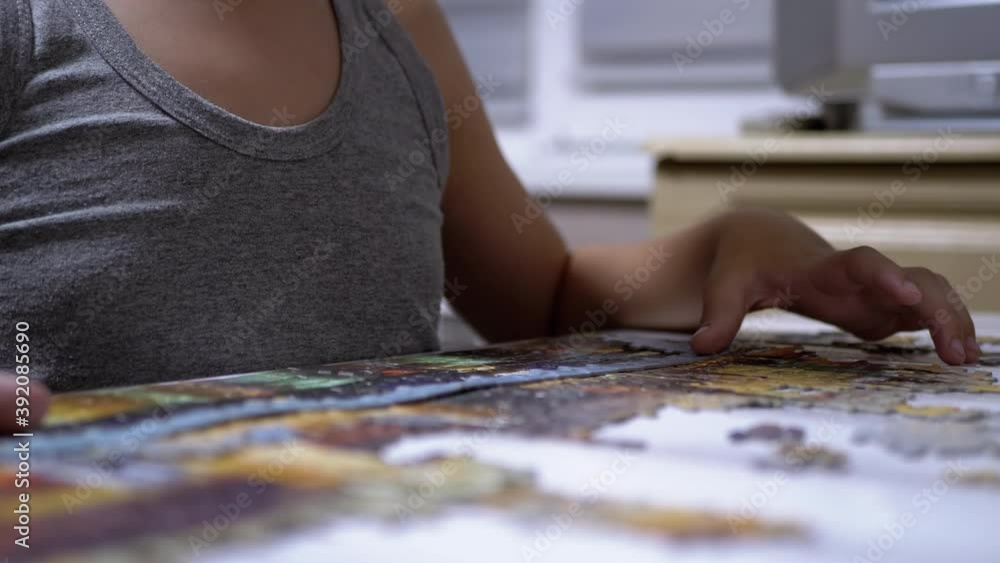 Teen Collect Puzzles on Table. Child Development Concept. Games for Quick Wits Teen Collect Puzzles on Table. Child Development Concept. Games for Quick Wits
