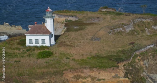 Pan right aerial, Cape Arago Lighthouse in Oregon photo