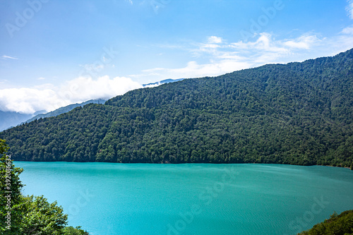 Turquoise lake in the mountains against the background of mountains