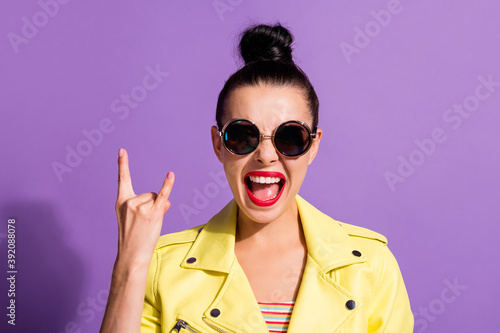Photo of excited crazy youngster girl show horns symbol isolated over violet color background © deagreez