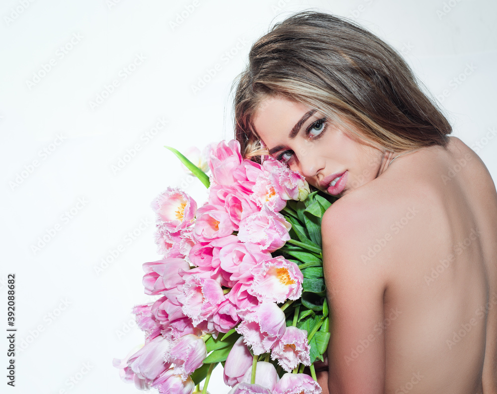 Spring sexy girl with tulips flowers bouquet isolated on white.