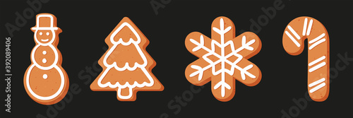 Set of Christmas or New year's gingerbread. The carvings are decorated with icing sugar. Vector stock flat illustration isolated on a black background.
