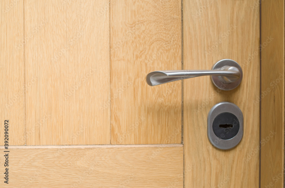 New lock on a wooden door close New lock on a wooden door close