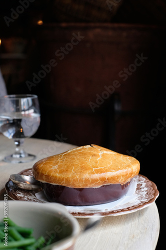 Traditional British homemade pie served on the vintage plate