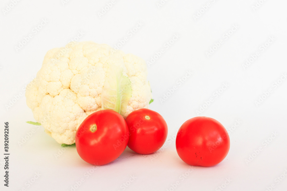 Cauliflower, tomato on a white background Cauliflower, tomato on a white background