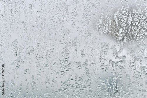 Background image of glacial translucent glass. The ice melts and flows down.