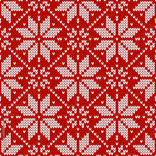 Christmas and New Year traditional knitted seamless pattern with snowflakes. Norwegian style sweater. Wool texture. Vector illustration. Holiday background.
