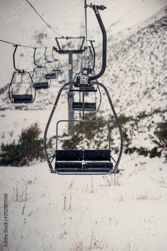 Chairlift in a snowing day at the ski resort. Asturias.