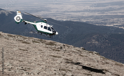 Mountain rescue helicopter, people rescue operation.