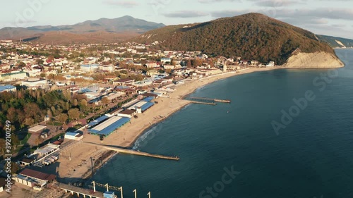 Beautiful aerial panorama of Arkhipo-Osipovka beach and promenade in Gelendzhik region, black sea coast, resort for vacations and pleasure, view from above. photo