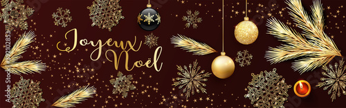 carte ou bandeau sur Joyeux Noël en or sur un fond marron avec des boules de Noël  noire et or des flocons de neige des branches de sapin et des étoiles en or et une bougie rouge 