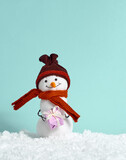 Christmas background with toy snowman.
