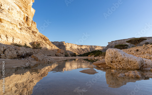 Canyon with oasis in the desert of Oman 