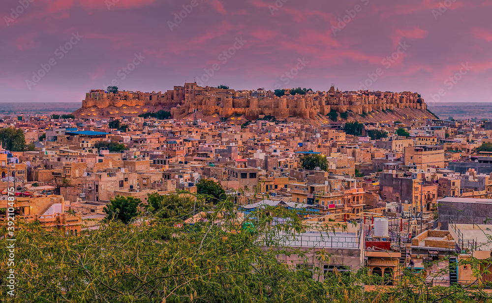 The old cliff top city of Jaisalmer illuminated in the night sky in Rajasthan, India