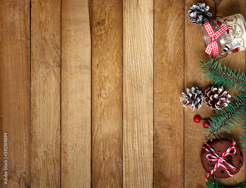Christmas gifts with christmas decoration on wooden background.