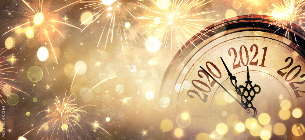 Fototapeta Countdown To Midnight - Happy New Year 2021 - Abstract Defocused Background - Clock And Fireworks
