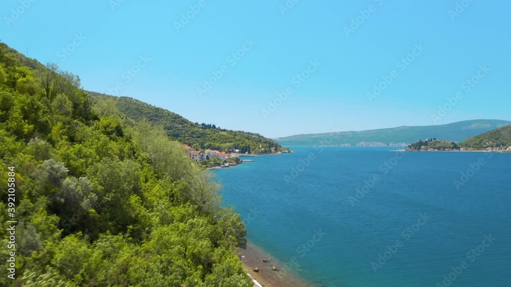 Perast, Montenegro. Aerial panoramic view of the beautiful seascape and mountains. Was filmed at summer day 