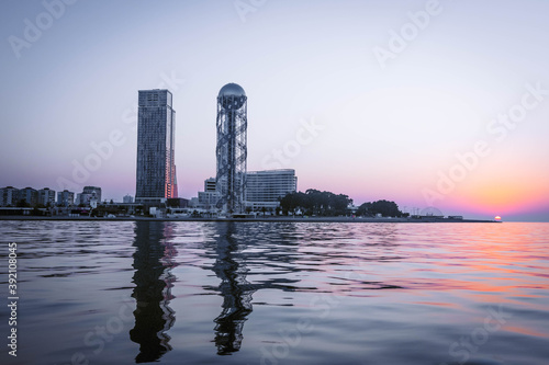 Panoramic View to Batumi coast and tourist attractions with romantic sunset in the bacground. Vacation holidays in caucasus. Georgian vegas. photo