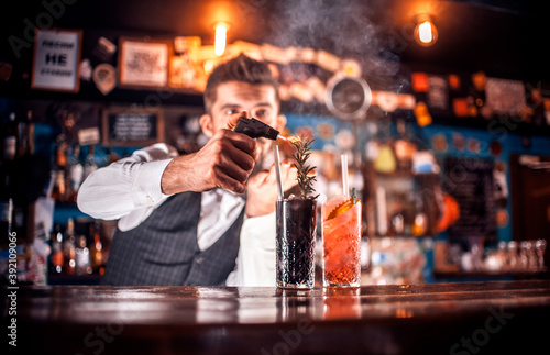 Barman makes a cocktail at the brasserie