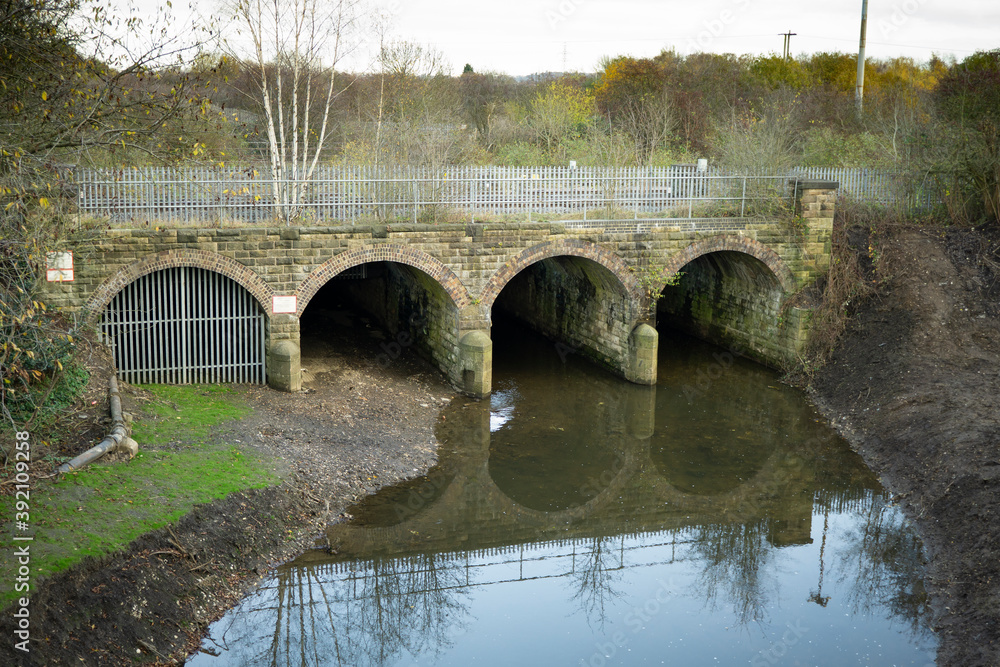 Four arched railway bridge over a small river