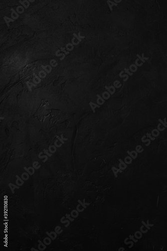 Black stone textured background, dark concrete surface