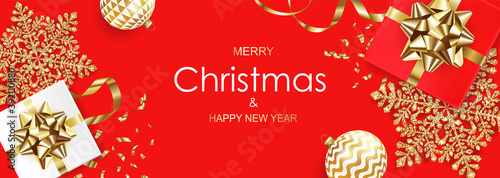 Merry Christmas and Happy New Year banner with gift boxes, golden glitter snowflakes, balls and confetti on red background. Vector ilustration.